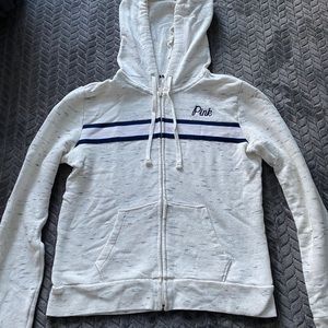 Pink zip up sweatshirt.